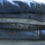 pile of denim jeans for upcycling projects