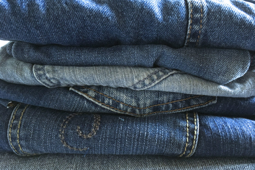 pile of denim jeans for upcycling projects
